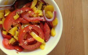 Roasted tomatoes, yellow bell peppers, red onions, and garlic